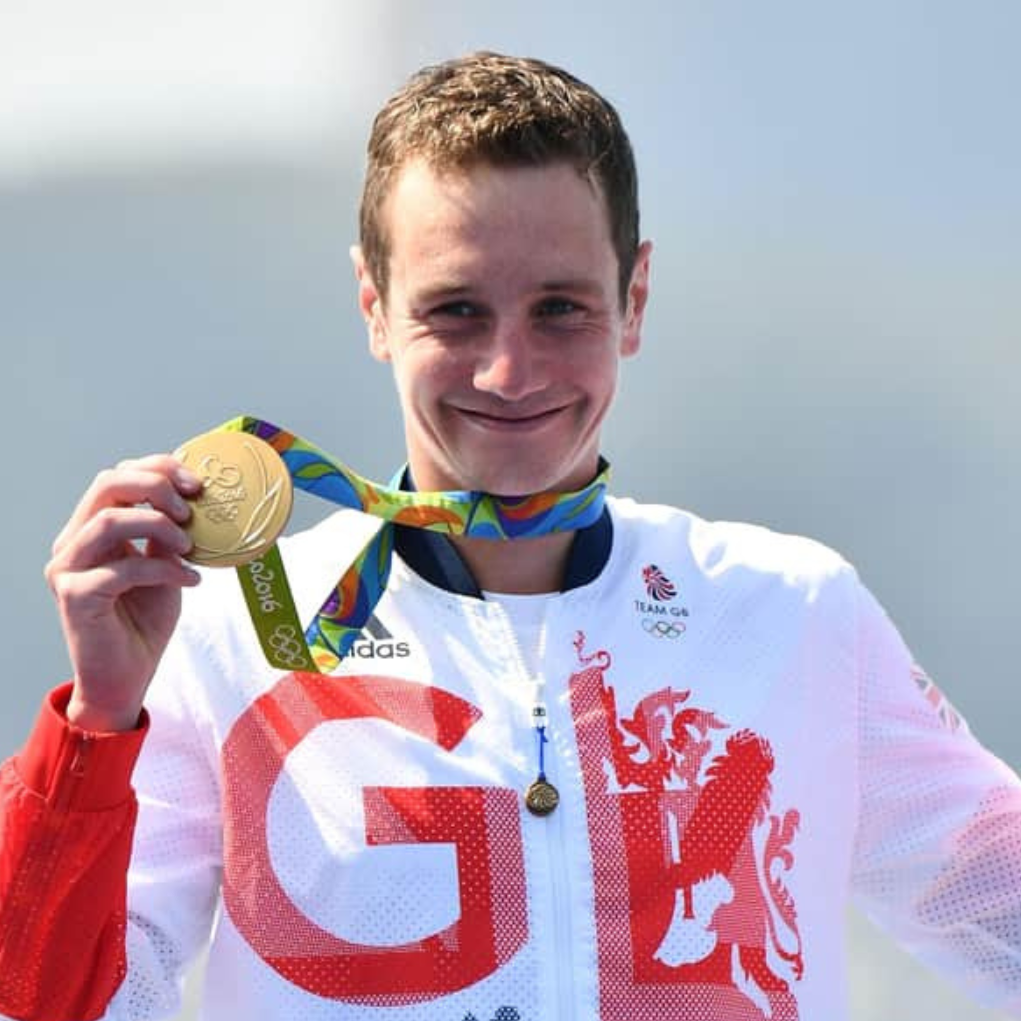A photo showing a member of Team GB holding a gold medal at the Olympic Games in Rio, 2016.