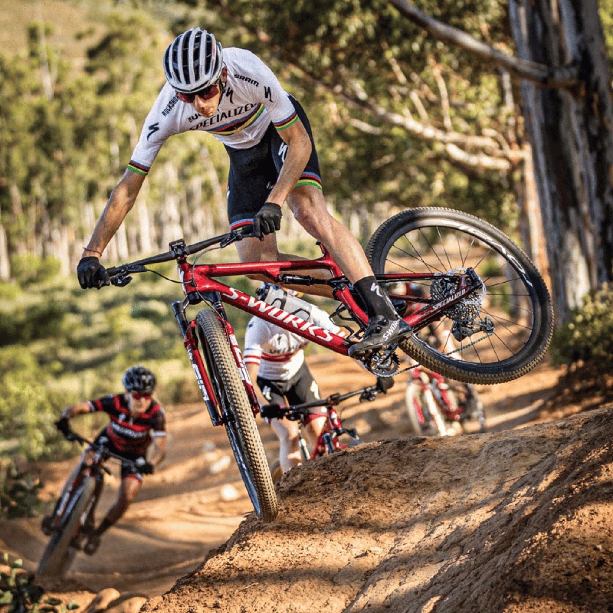 Jordan Sarrou wearing a world champions jersey on a downhill MTB ride, wearing Pelotan Performance Sunscreen