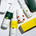 Bottles of Pelotan’s recovery and performance sunscreen products are laid on a white background, showing products that are official products of the Tour de France.