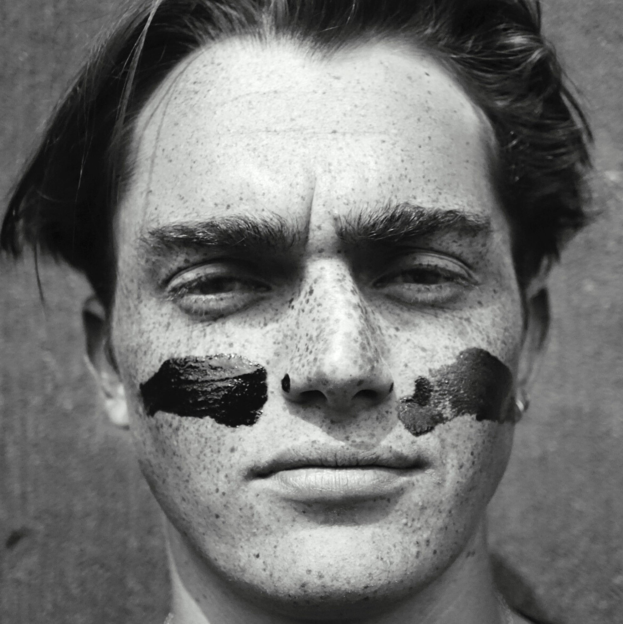 Model with Pelotan sunscreen applied, as seen by an ultraviolet camera.