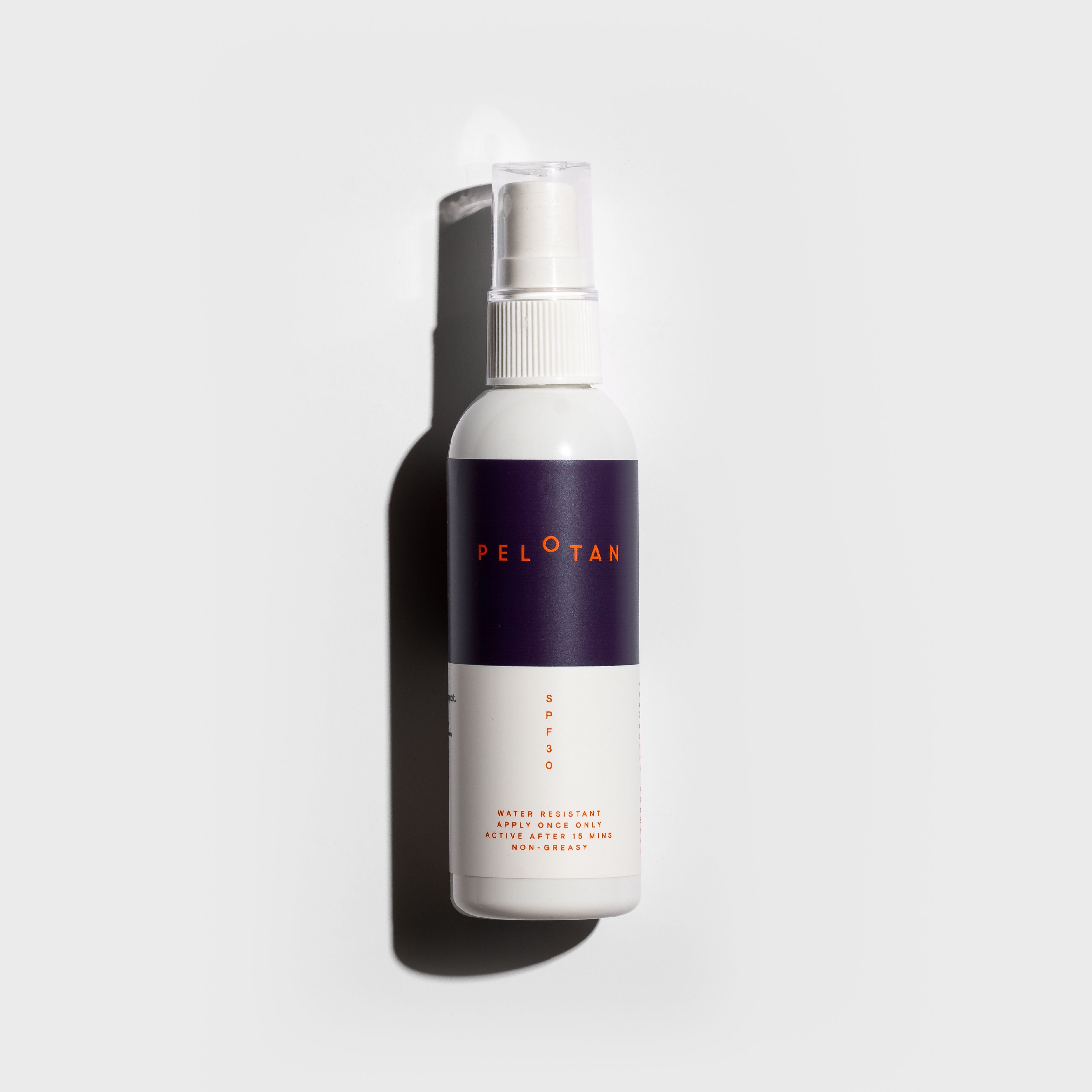 A bottle of Pelotan’s 100ml sunscreen spray bottle on a white background.