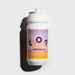 A white cycling water bottle, with an amber sunset image and the Pelotan logo on its side is laid on a white background.