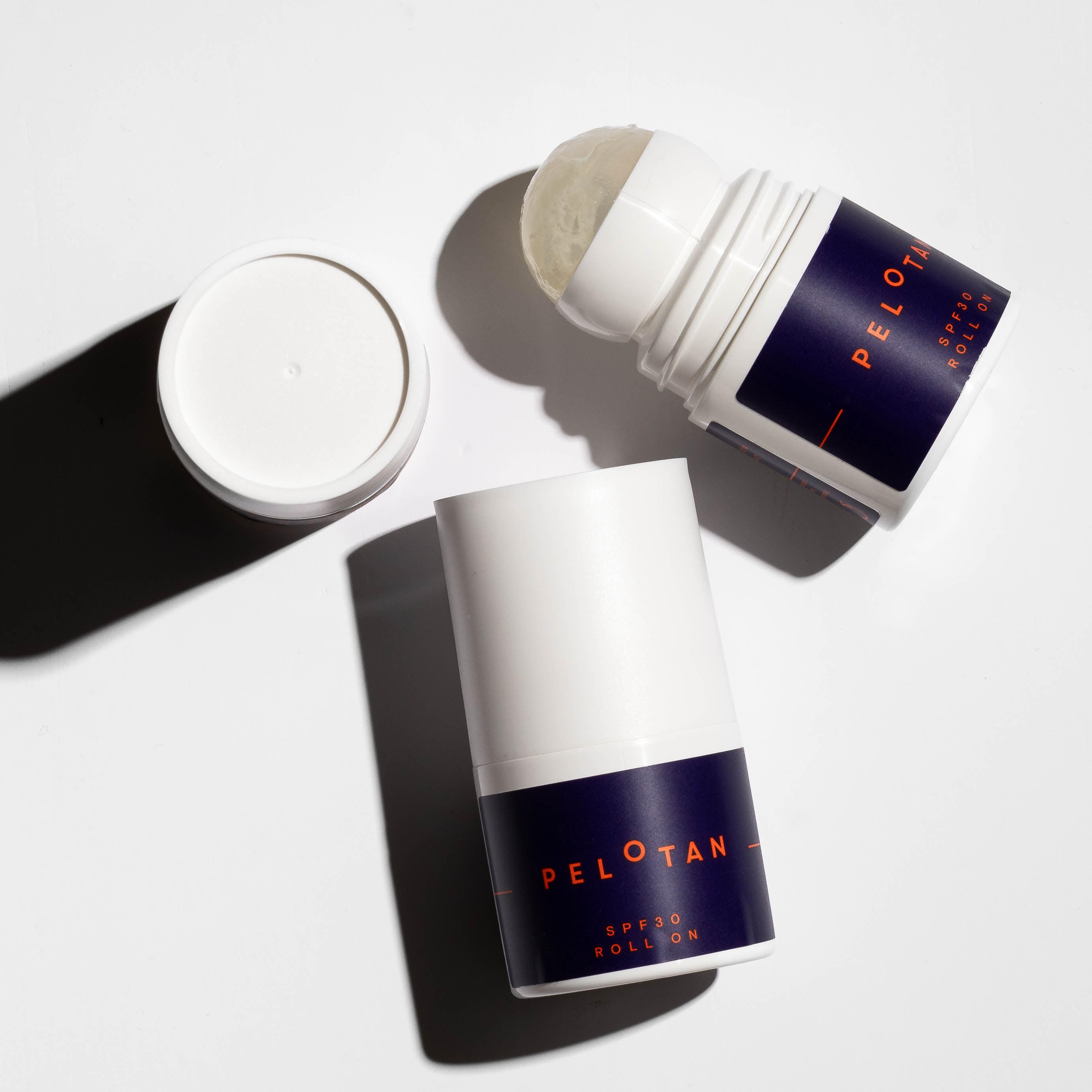 Two Pelotan 50ml sunscreen rollon SPF30s are laid on a white background.