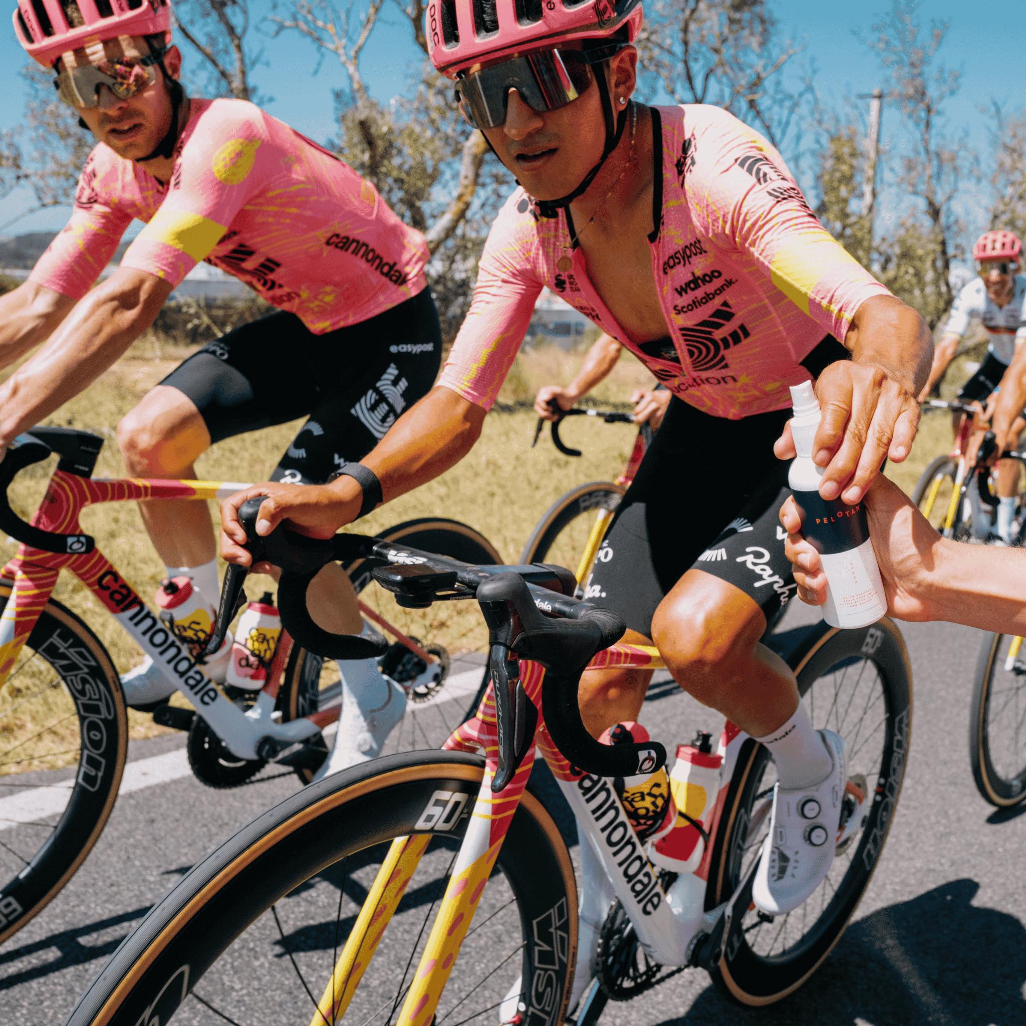 Pelotan SPF30 Sunscreen Being Handed to a Rider from EF Pro Cycling